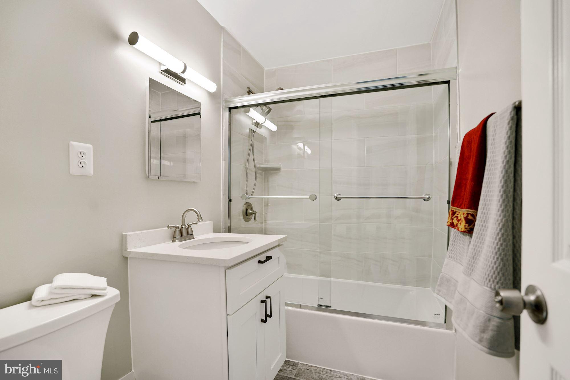 9101 Old Keene Mill Road Springfield, VA 22152 - Photo 22 of 28 a bathroom with a sink toilet and shower