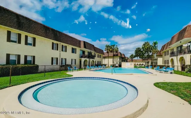 a view of a house with swimming pool