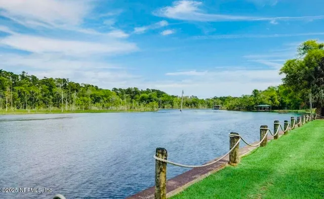 a view of a lake with a yard