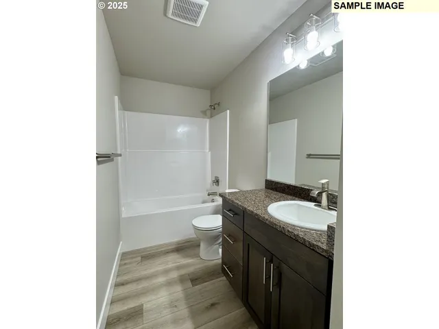 a view of street with large trees