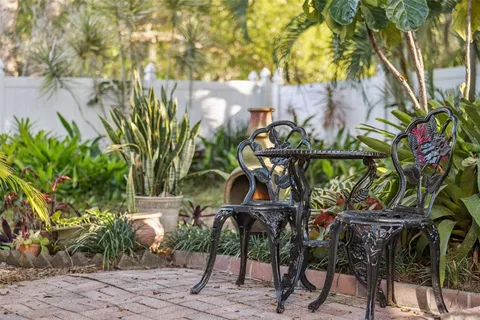 a kitchen with stainless steel appliances granite countertop a refrigerator a sink dishwasher a stove with wooden cabinets