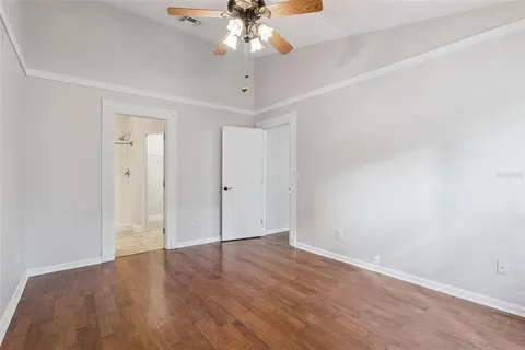 a bathroom with a sink vanity granite tub and shower
