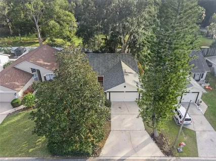 an aerial view of a house with a swimming pool