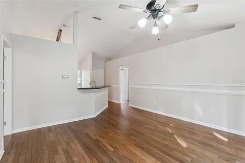 a backyard of a house with table and chairs