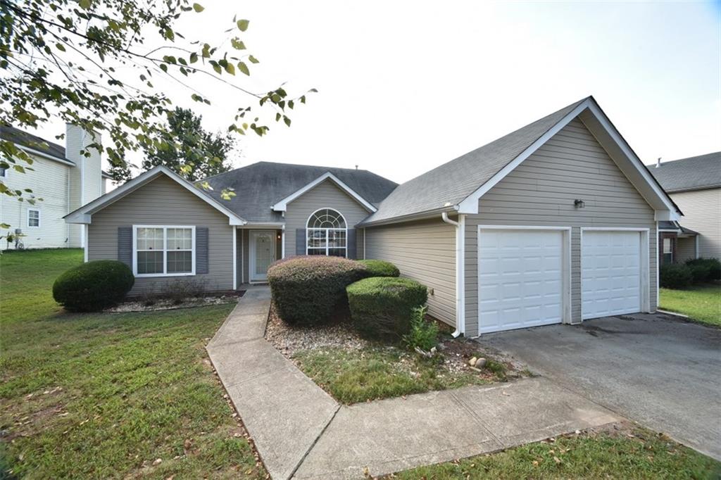 Welcome Home! 2 car garage & paved walkway 