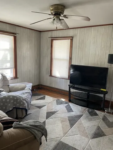 a bedroom with a bed and a television