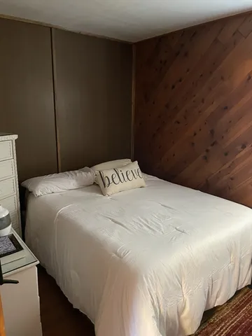 a bedroom with a bed and a cabinets