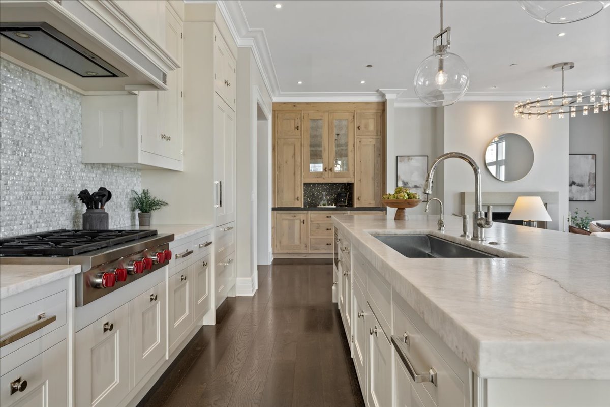 9 West Walton Street, Unit 702 Chicago, IL 60610 - Photo 11 of 38 a kitchen with cabinets a sink and appliances