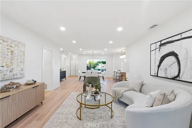 a living room with furniture or couch and a potted plant
