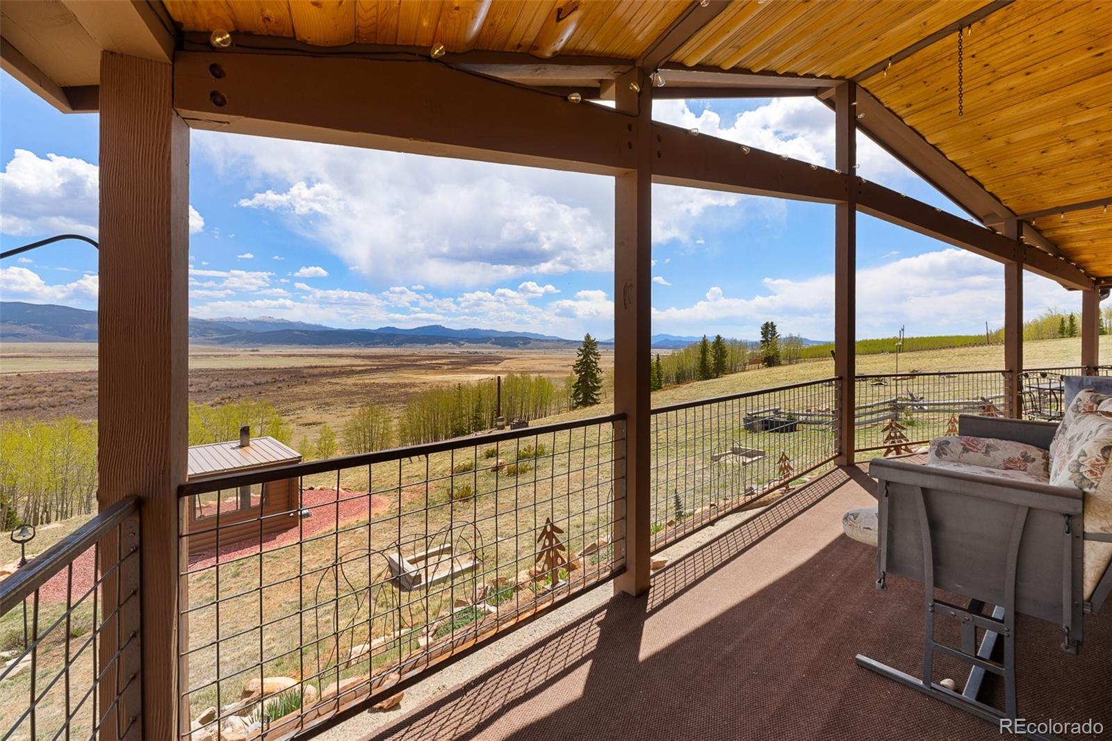 1163 Michigan Hill Road Jefferson, CO 80456 - Photo 24 of 48 a view of lake with mountain view from a window