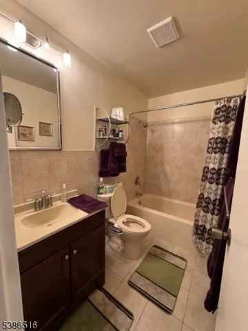 a bed room with a bed and a television