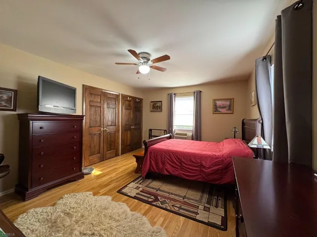 a room with furniture pool table and flat screen tv