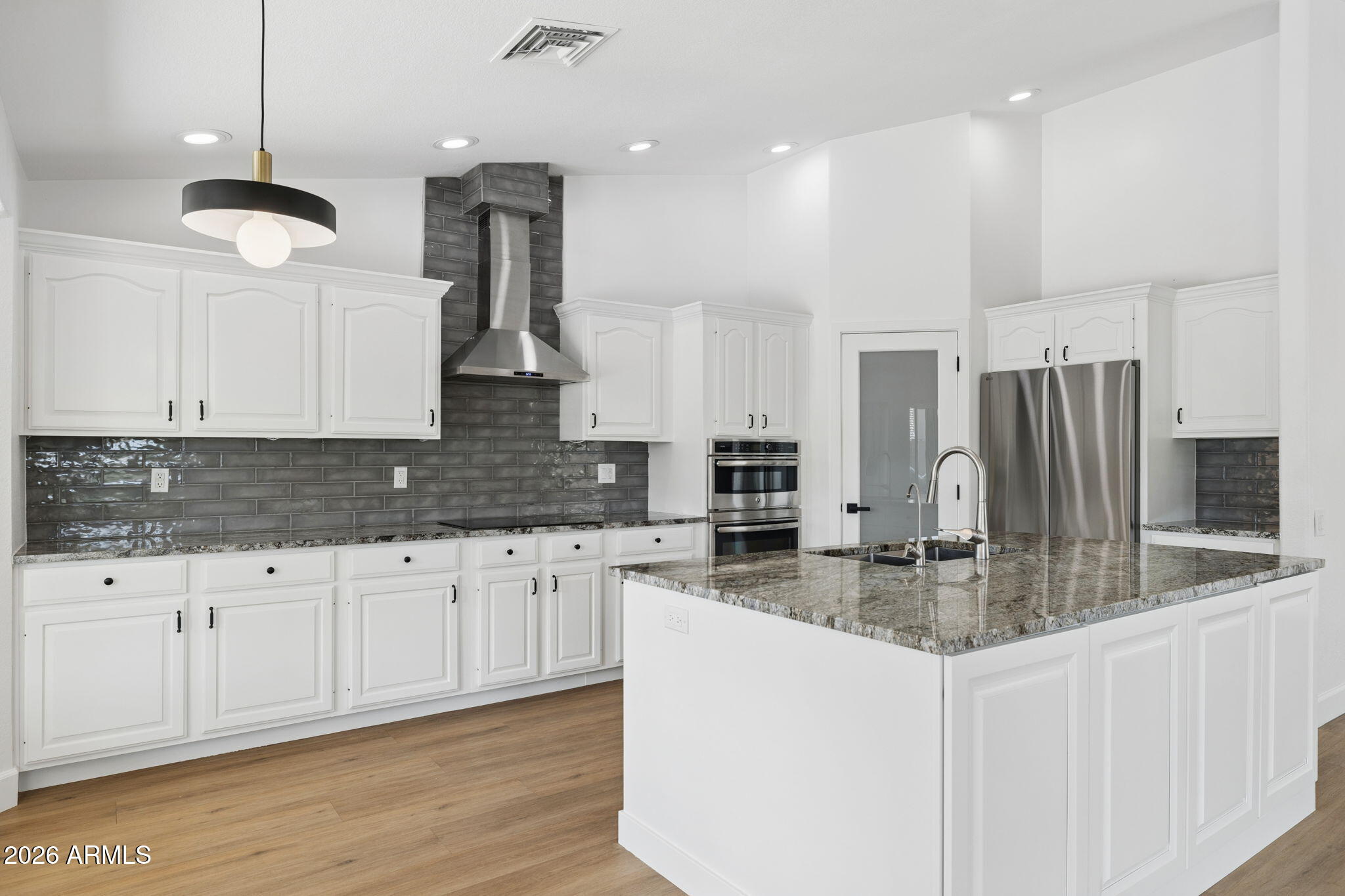 2451 East Dry Creek Road Phoenix, AZ 85048 - Photo 11 of 56 a kitchen with stainless steel appliances granite countertop a sink refrigerator and cabinets