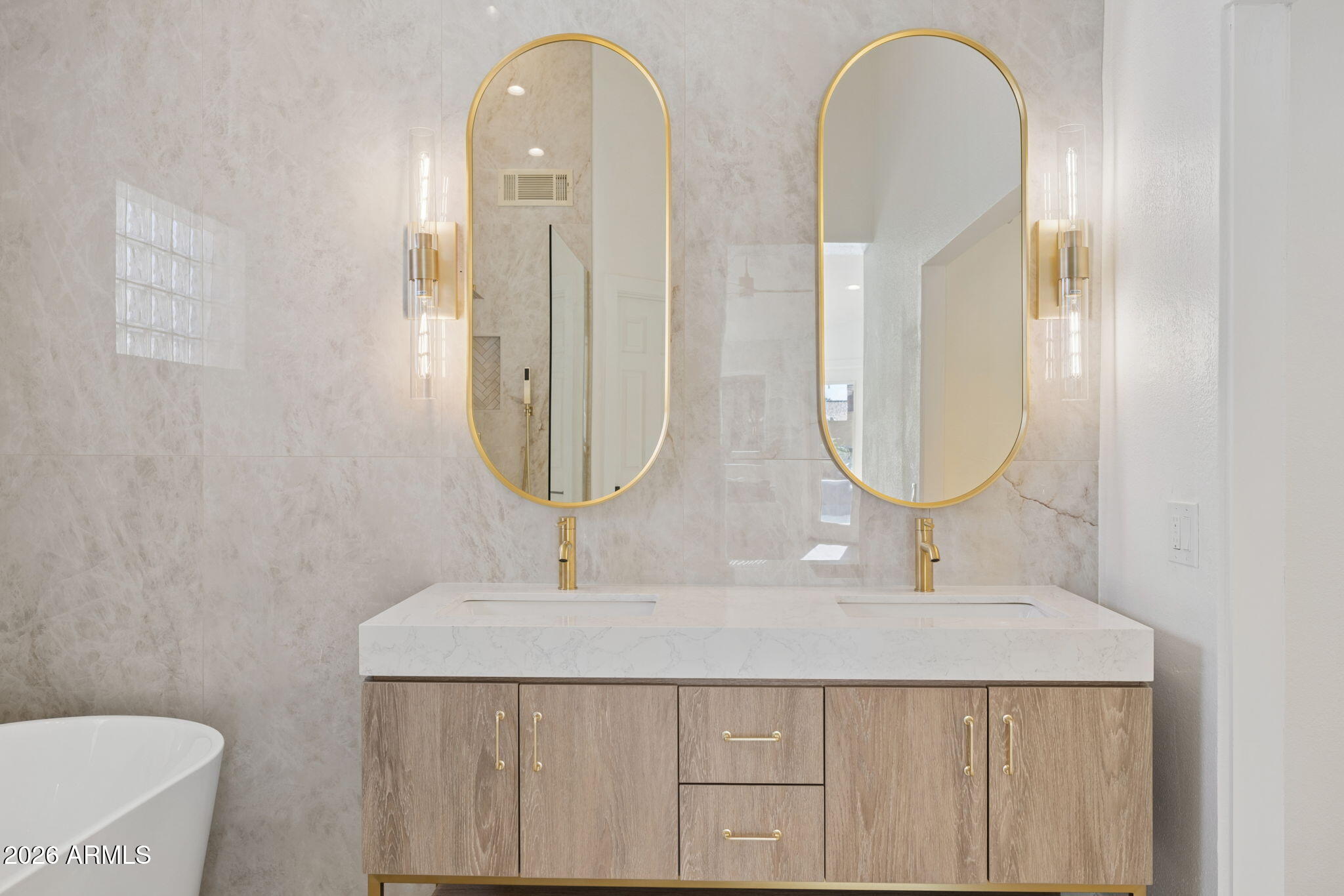 2451 East Dry Creek Road Phoenix, AZ 85048 - Photo 20 of 56 a bathroom with 2 sink and a mirror