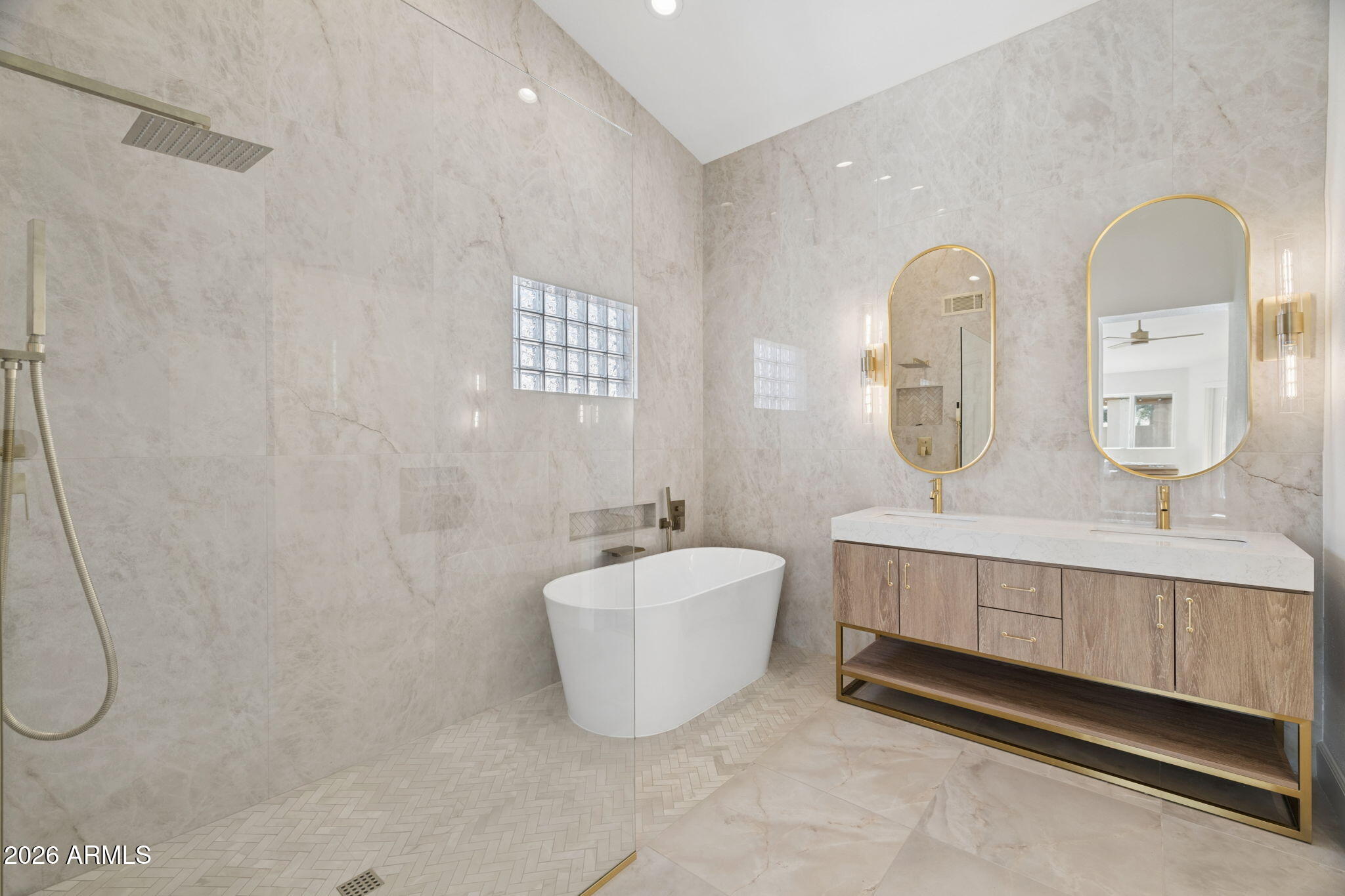 2451 East Dry Creek Road Phoenix, AZ 85048 - Photo 21 of 56 a bathroom with a double vanity sink mirror and bathtub