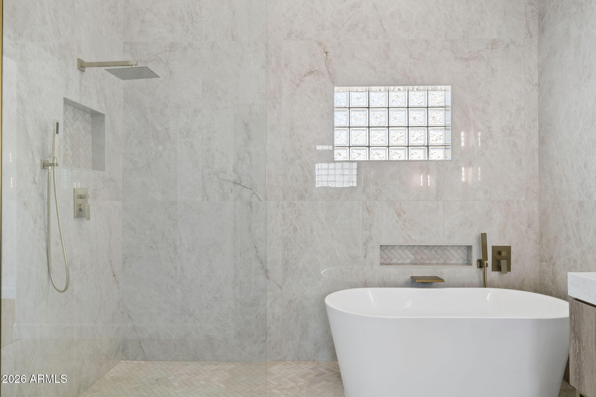 2451 East Dry Creek Road Phoenix, AZ 85048 - Photo 24 of 56 a white bath tub sitting next to a white sink