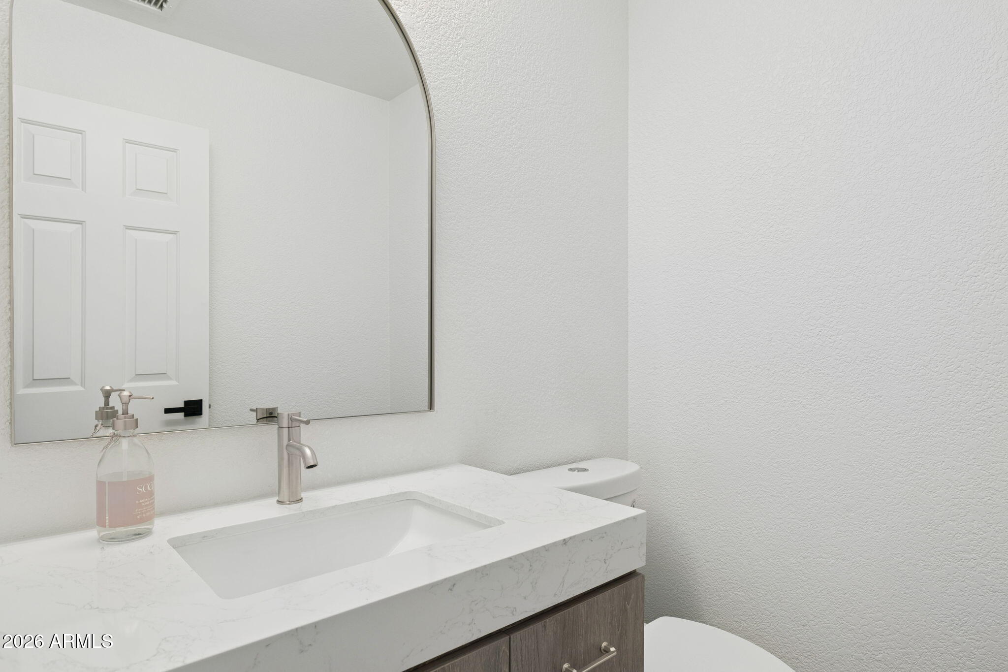 2451 East Dry Creek Road Phoenix, AZ 85048 - Photo 30 of 56 a bathroom with a sink and a toilet