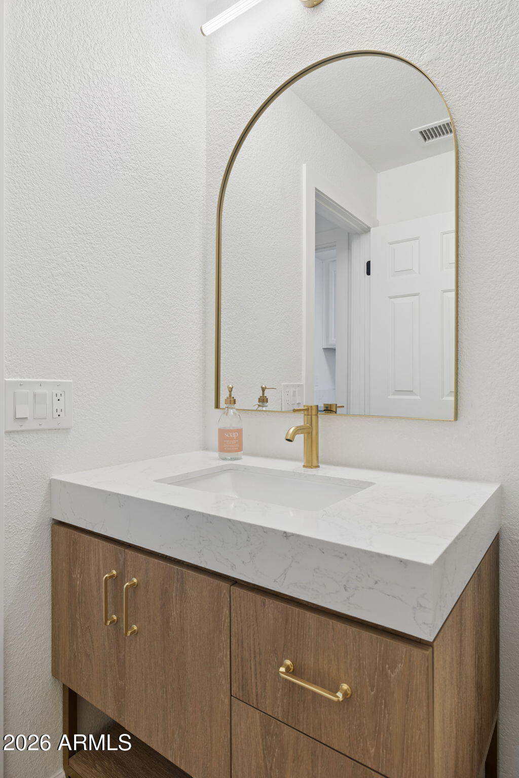 2451 East Dry Creek Road Phoenix, AZ 85048 - Photo 31 of 56 a bathroom with a sink and a mirror