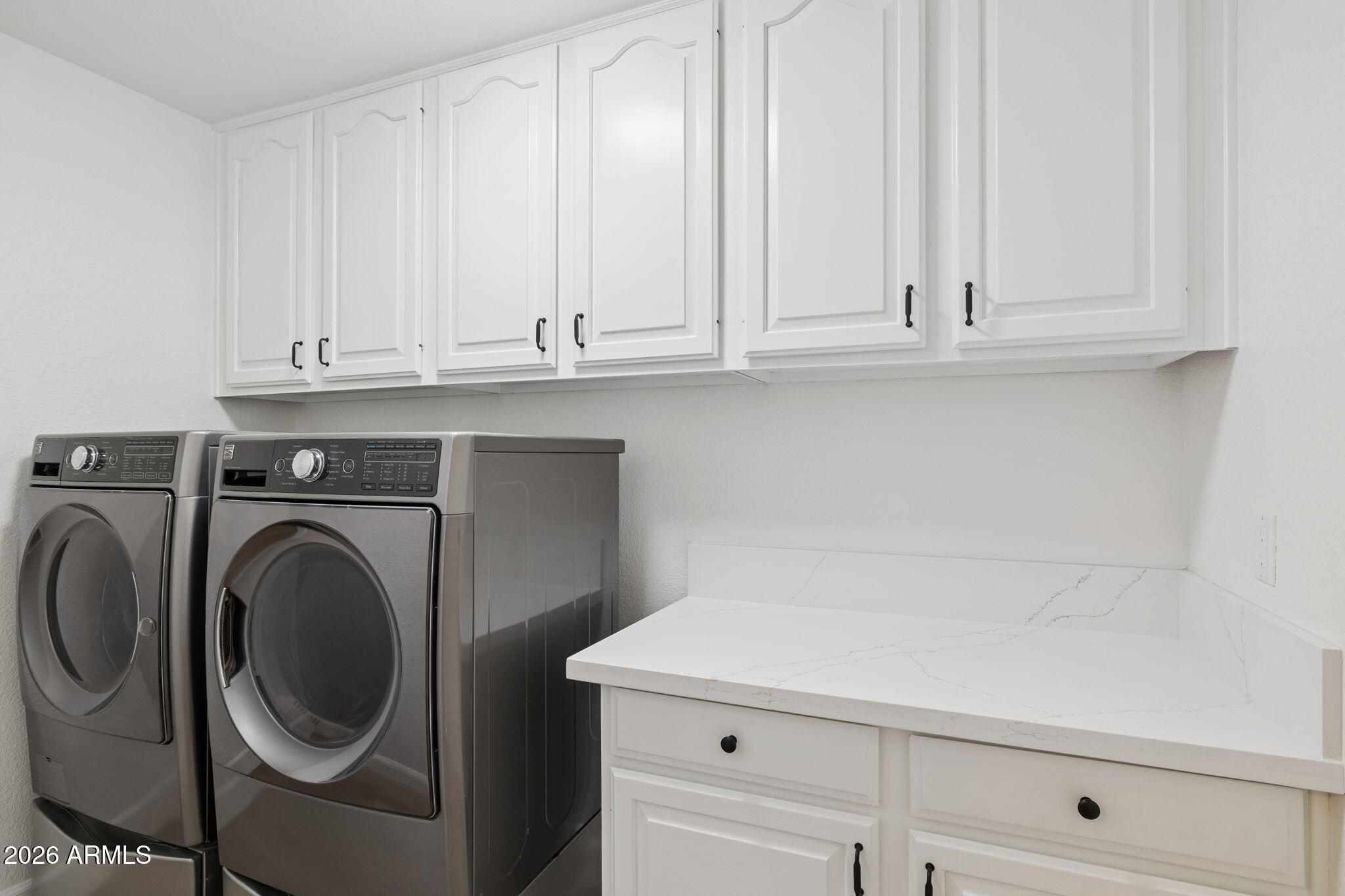2451 East Dry Creek Road Phoenix, AZ 85048 - Photo 32 of 56 a close view of a utility room with dryer and washer