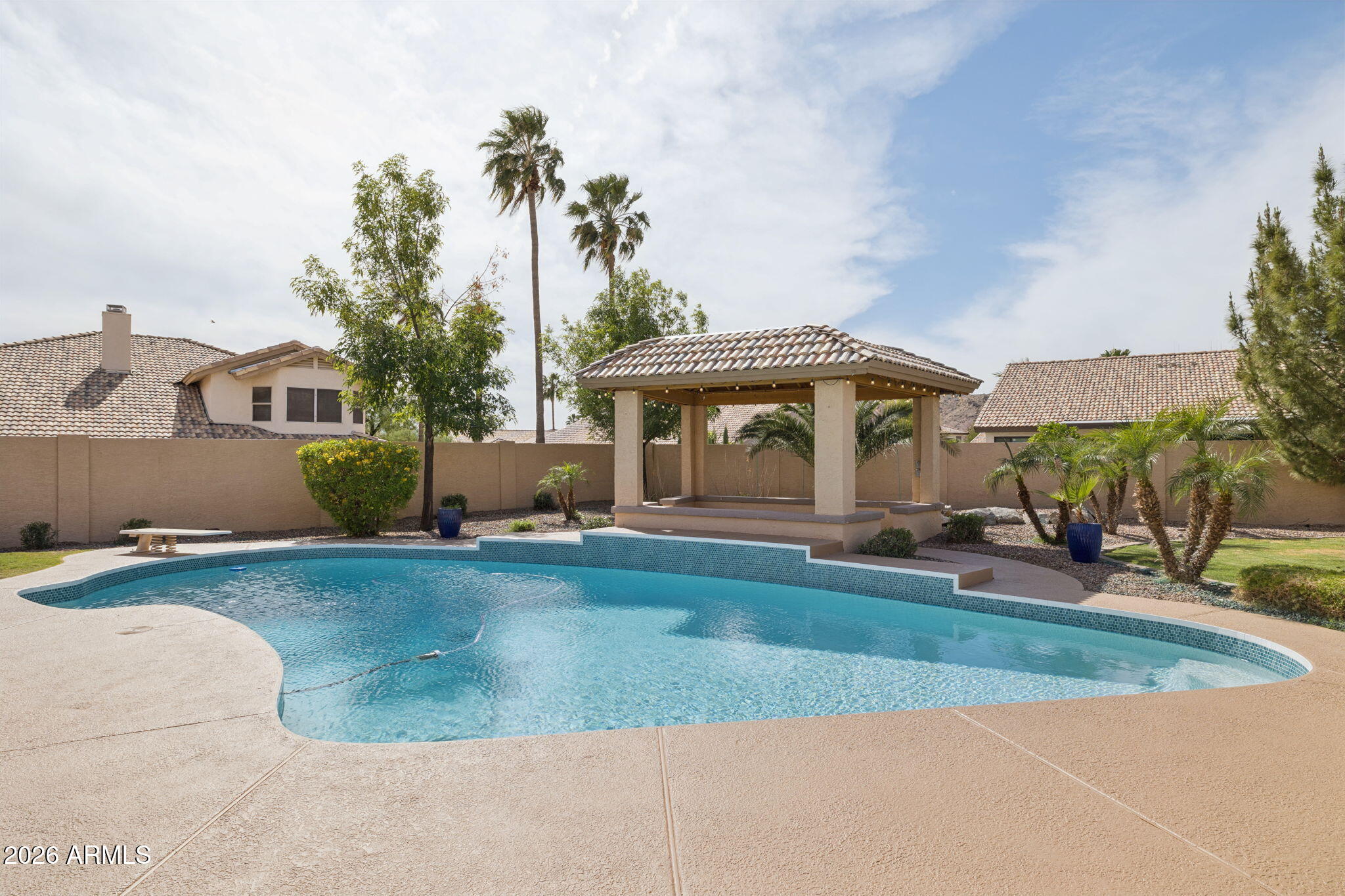 2451 East Dry Creek Road Phoenix, AZ 85048 - Photo 37 of 56 a front view of a house with garden