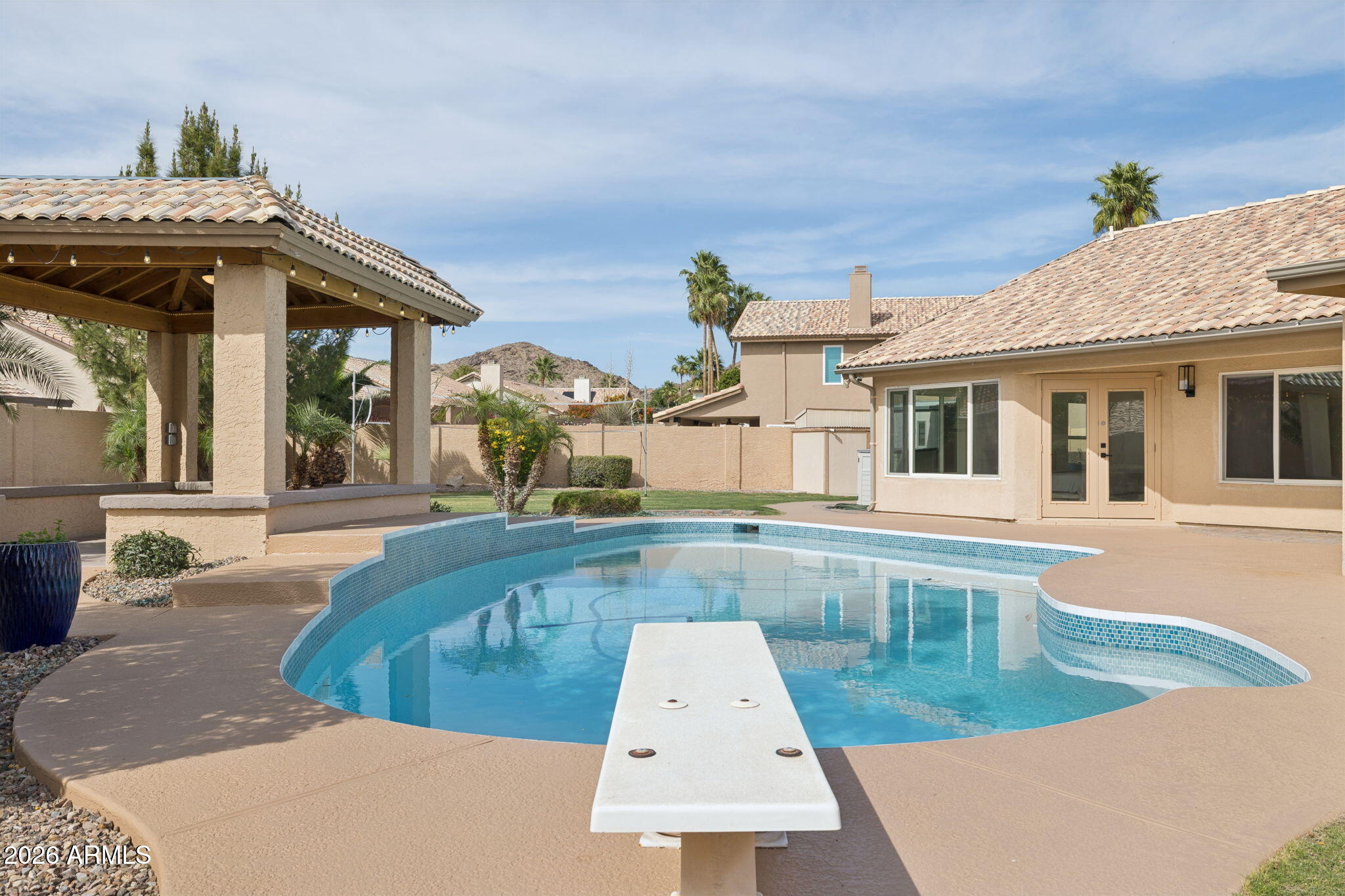 2451 East Dry Creek Road Phoenix, AZ 85048 - Photo 44 of 56 a view of a house with a swimming pool