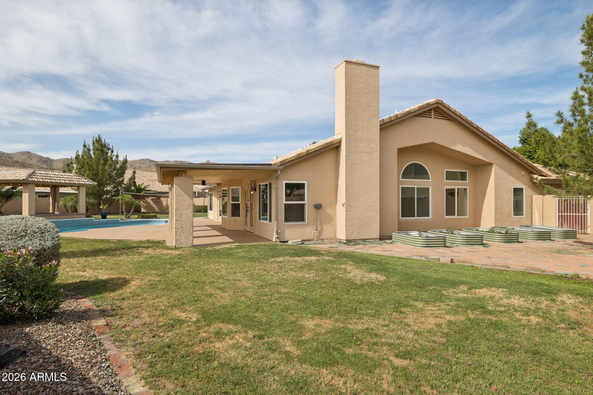 2451 East Dry Creek Road Phoenix, AZ 85048 - Photo 45 of 56 a front view of a house with a yard