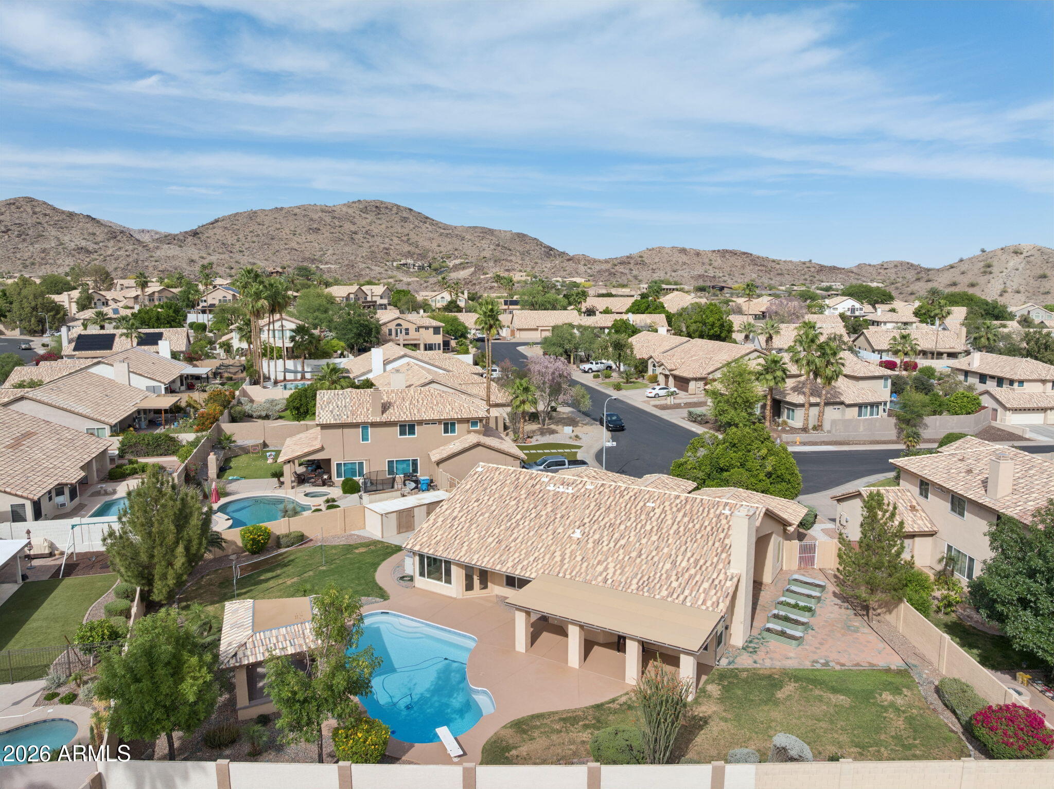 2451 East Dry Creek Road Phoenix, AZ 85048 - Photo 49 of 56 an aerial view of residential houses with outdoor space and trees
