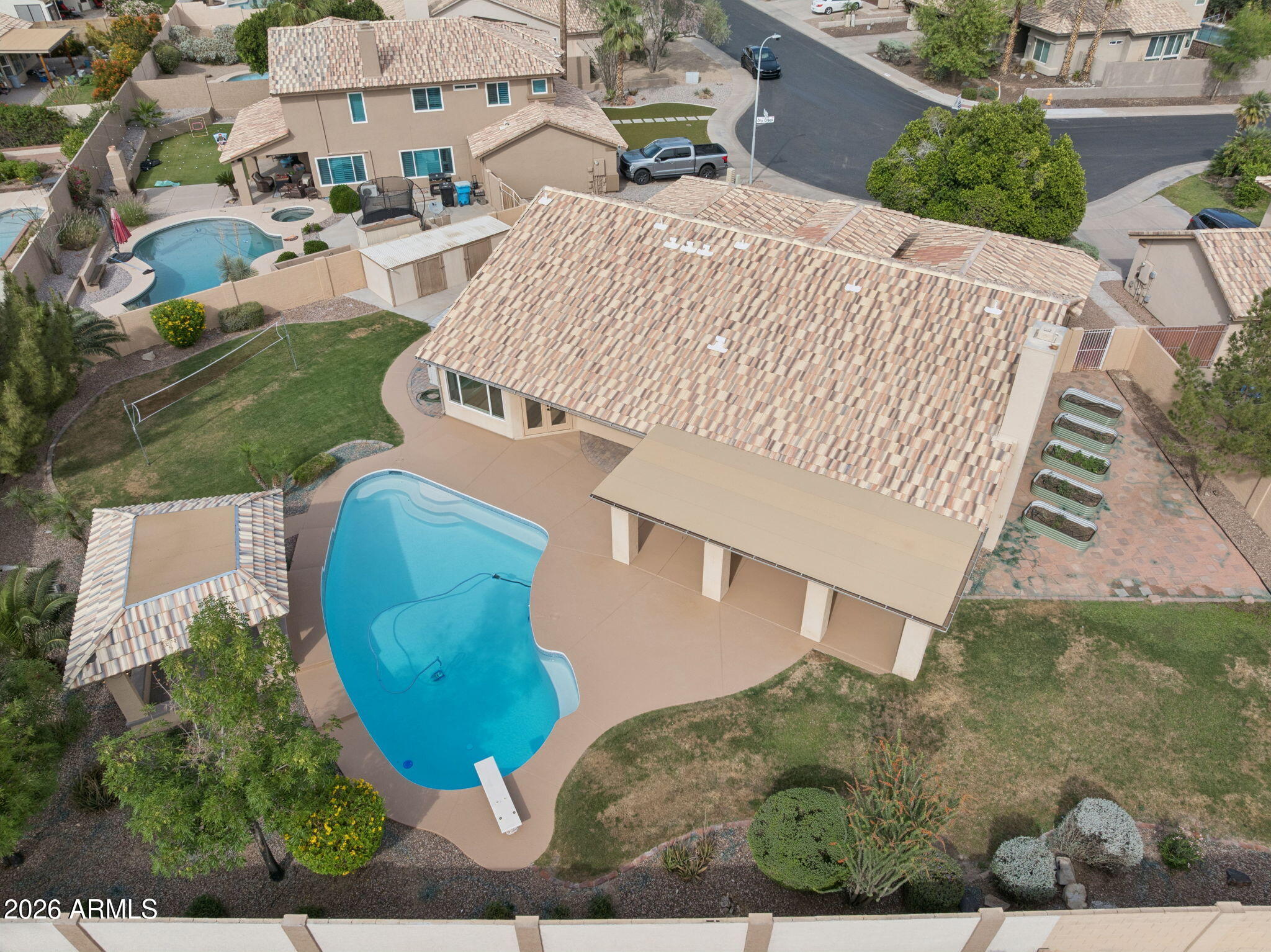 2451 East Dry Creek Road Phoenix, AZ 85048 - Photo 50 of 56 an aerial view of a house with a yard and pool