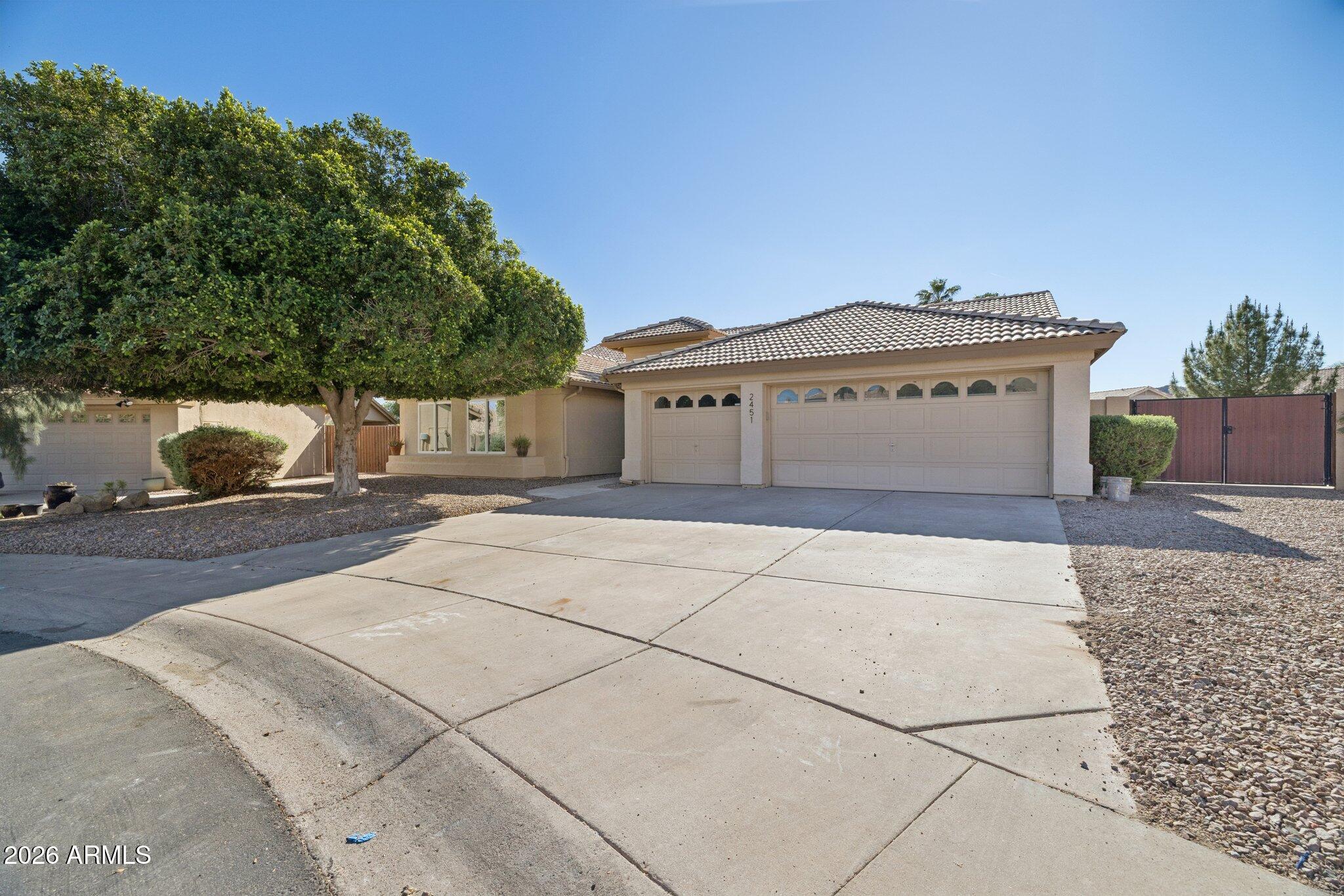 2451 East Dry Creek Road Phoenix, AZ 85048 - Photo 4 of 56 a front view of a house with a yard