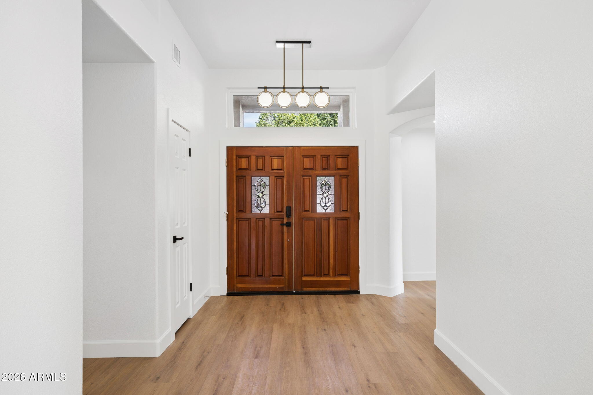 2451 East Dry Creek Road Phoenix, AZ 85048 - Photo 5 of 56 a view of an entryway with wooden floor