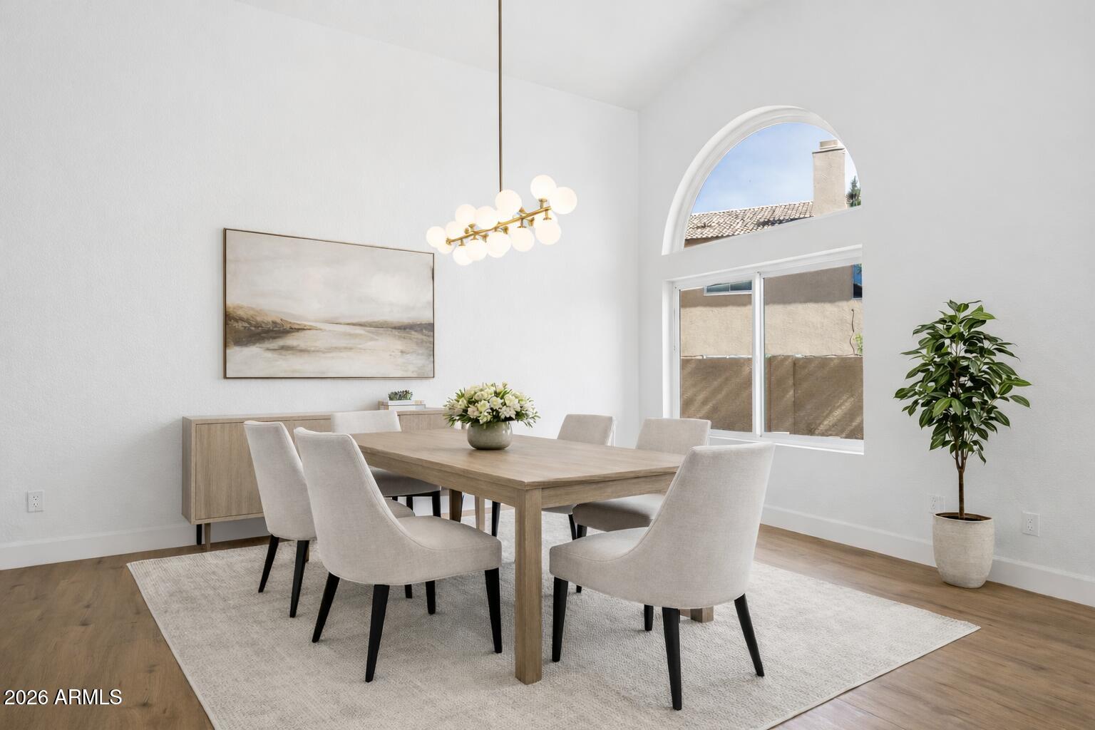 2451 East Dry Creek Road Phoenix, AZ 85048 - Photo 7 of 56 a view of a dining room with furniture window and wooden floor