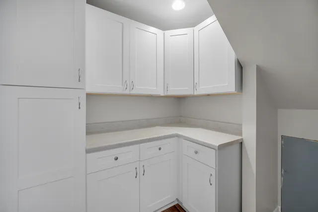 a view of cabinets with wooden floor