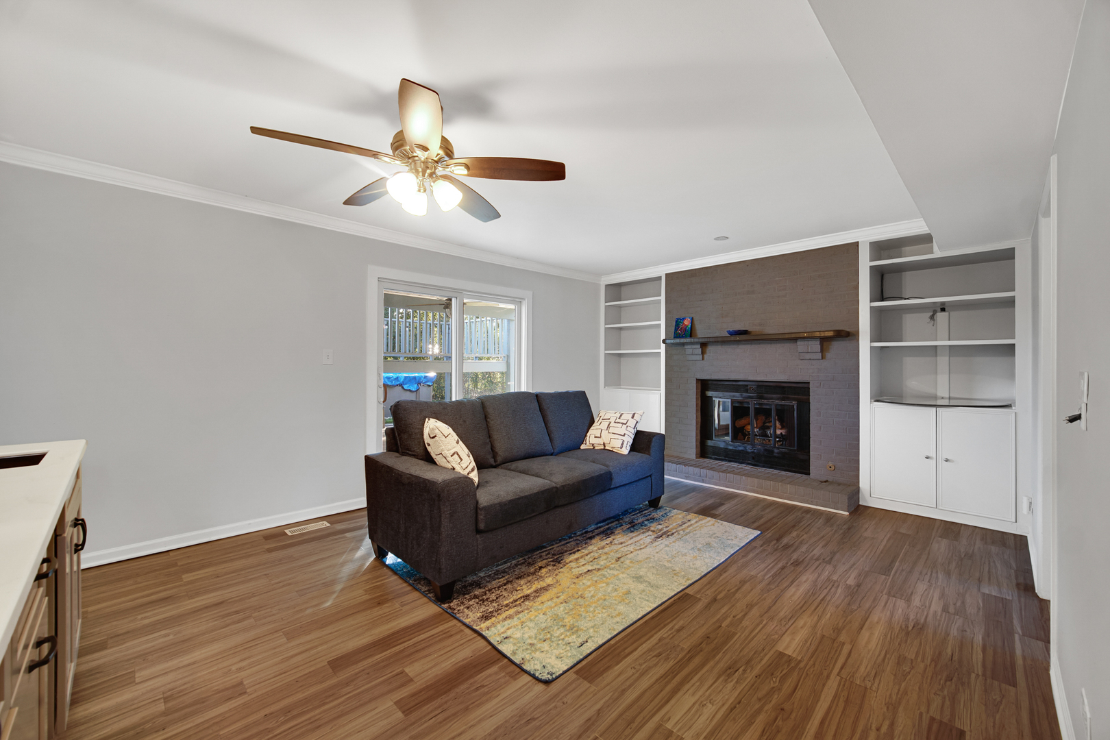 2S111 Churchill Lane Glen Ellyn, IL 60137 - Photo 12 of 34 a living room with furniture and a fireplace