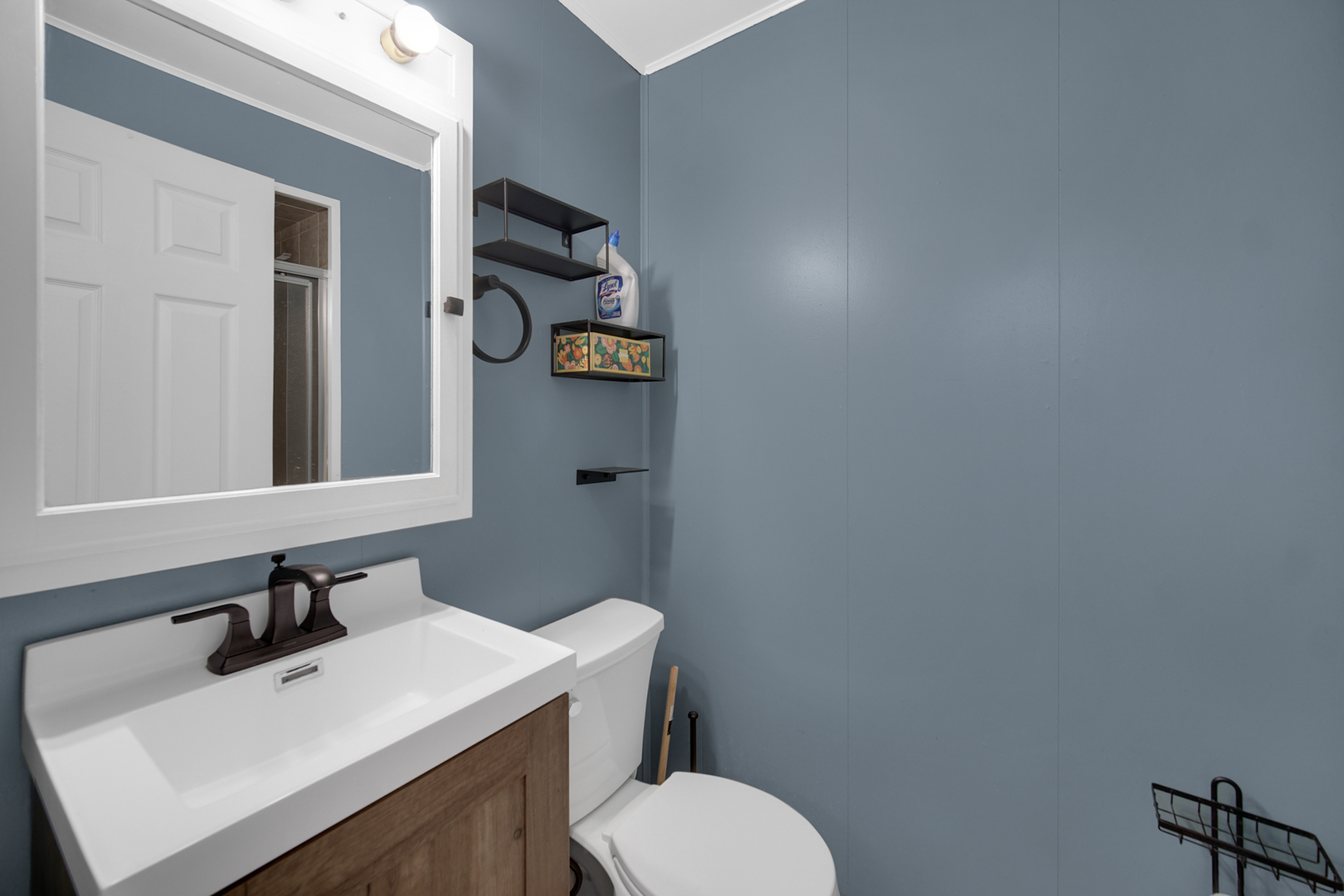 2S111 Churchill Lane Glen Ellyn, IL 60137 - Photo 14 of 34 a bathroom with a toilet sink and mirror