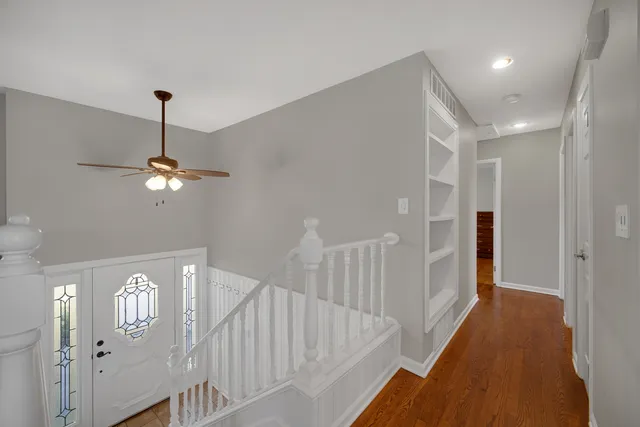 a view of a hallway with a chandelier