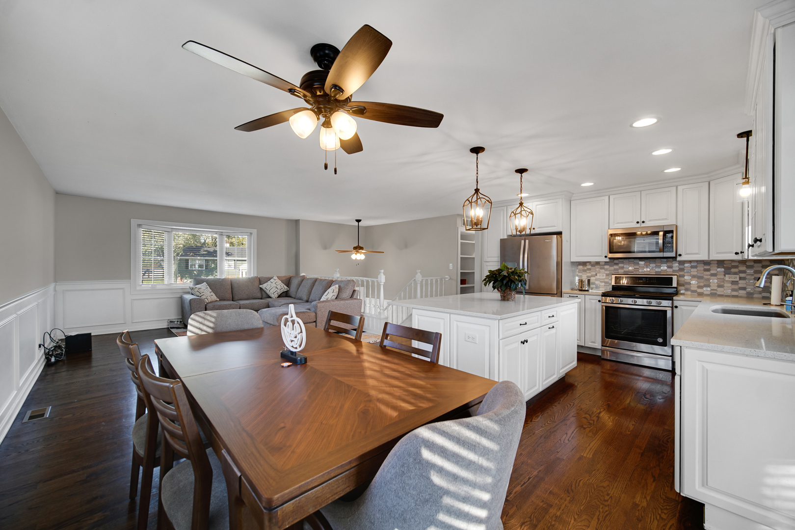 2S111 Churchill Lane Glen Ellyn, IL 60137 - Photo 7 of 34 a open dining room with stainless steel appliances kitchen island granite countertop furniture and a kitchen view