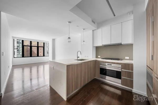 a kitchen with stainless steel appliances granite countertop a stove and a sink