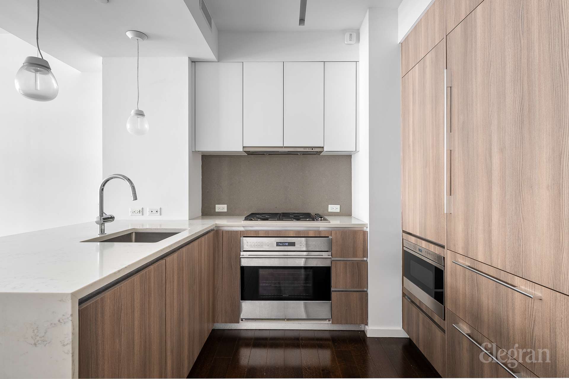 591 3rd Avenue, Unit 12A Manhattan, NY 10016 - Photo 3 of 14 a kitchen with stainless steel appliances granite countertop a sink stove and refrigerator