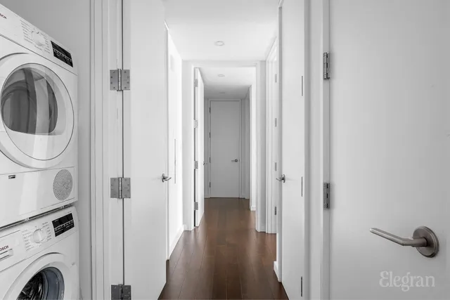 a bathroom with a double vanity sink mirror and toilet