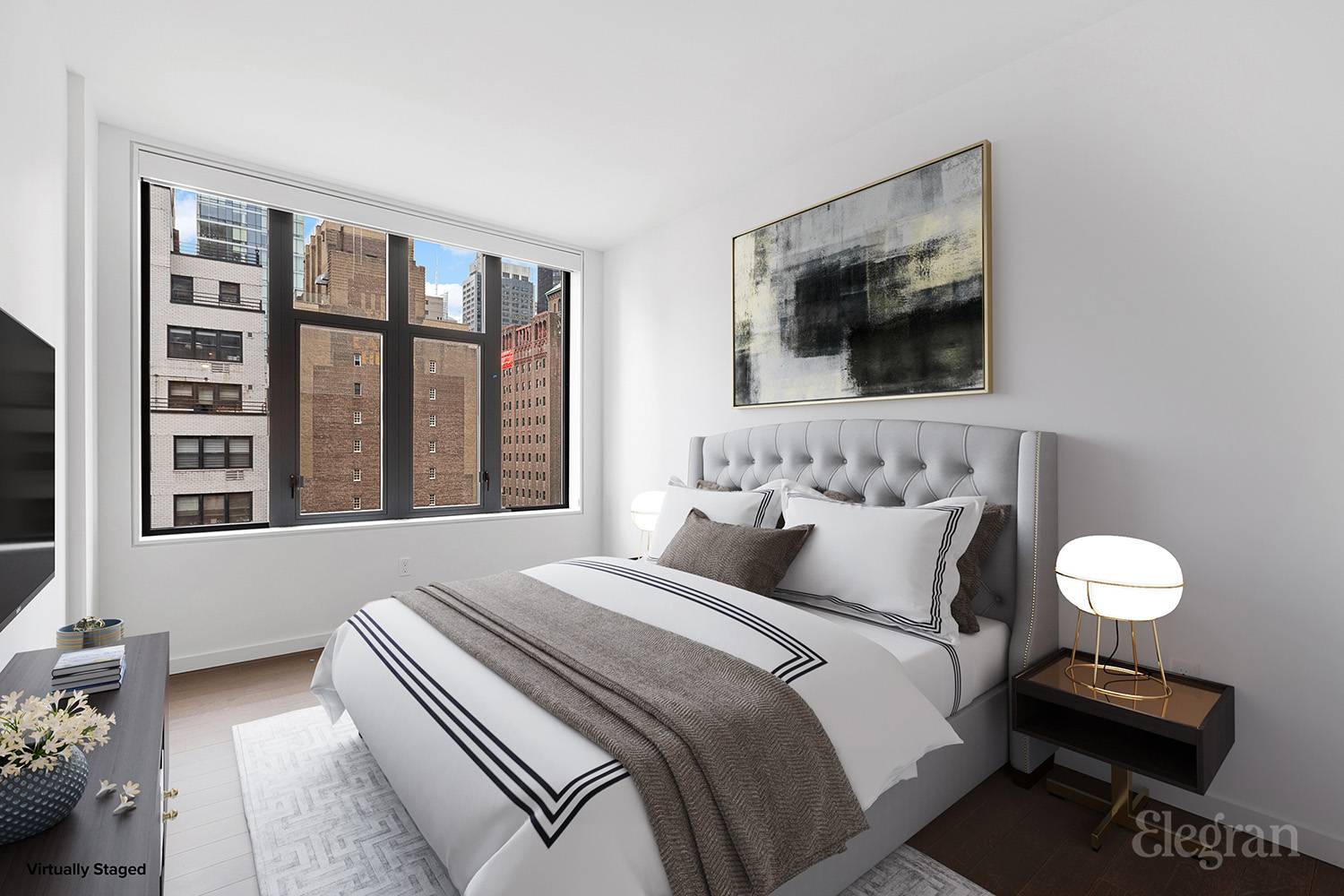 591 3rd Avenue, Unit 12A Manhattan, NY 10016 - Photo 9 of 14 a bedroom with furniture and a flat screen tv