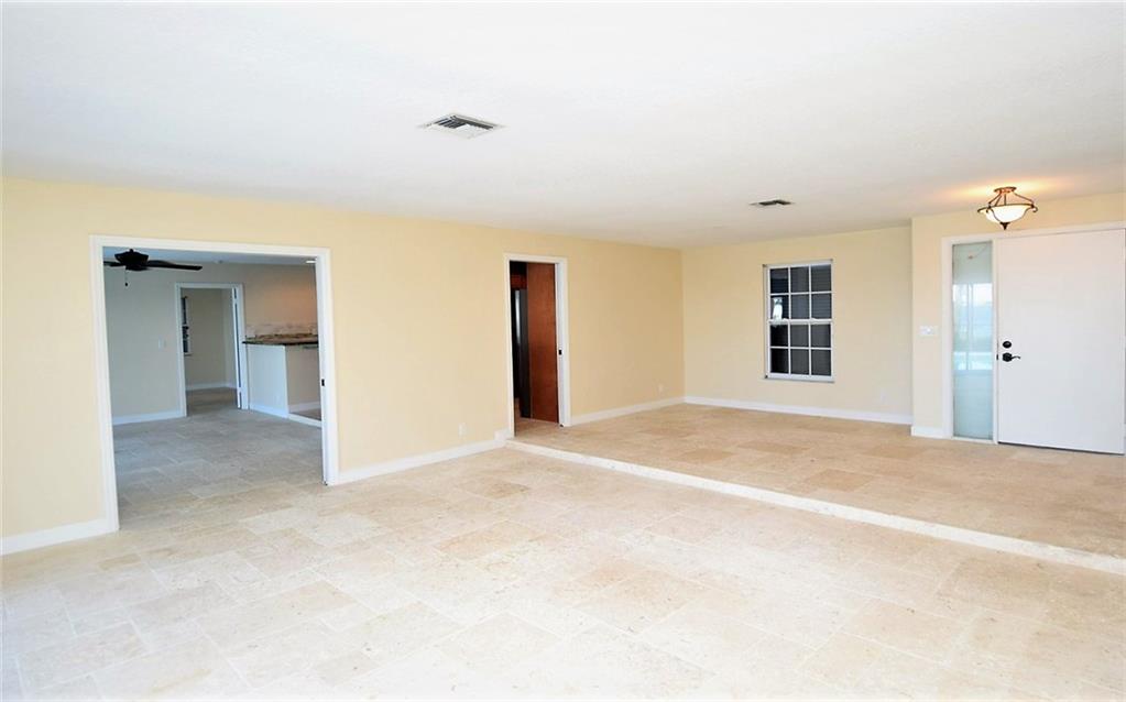 831 Southeast Riverside Drive Stuart, FL 34994 - Photo 8 of 36 a view of a livingroom with a staircase