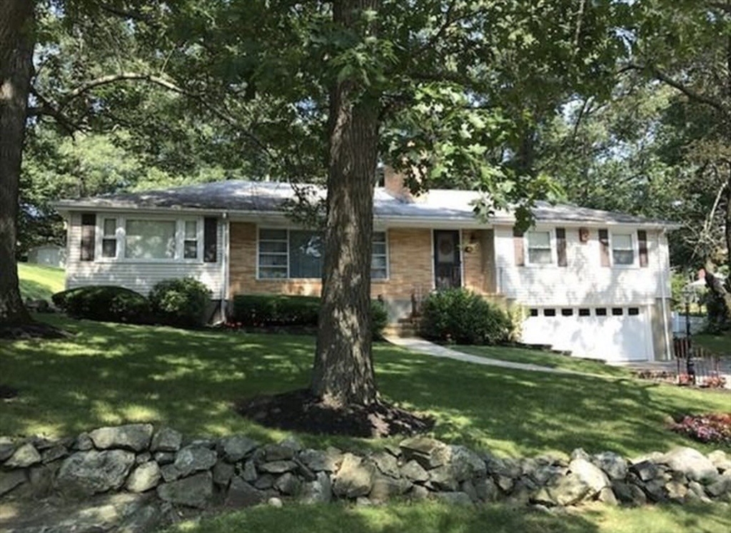 174 Forest Street Waltham, MA 02452 - Photo 1 of 15 a front view of a house with garden