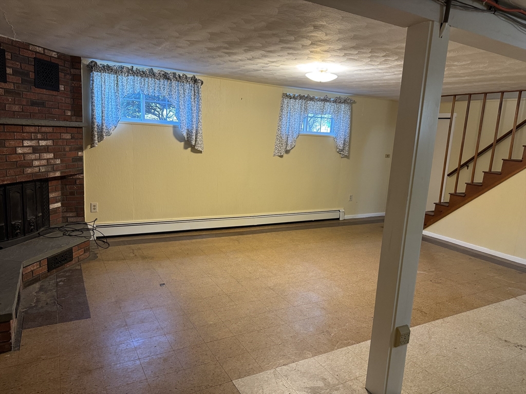 174 Forest Street Waltham, MA 02452 - Photo 11 of 15 a view of a room with wooden floor