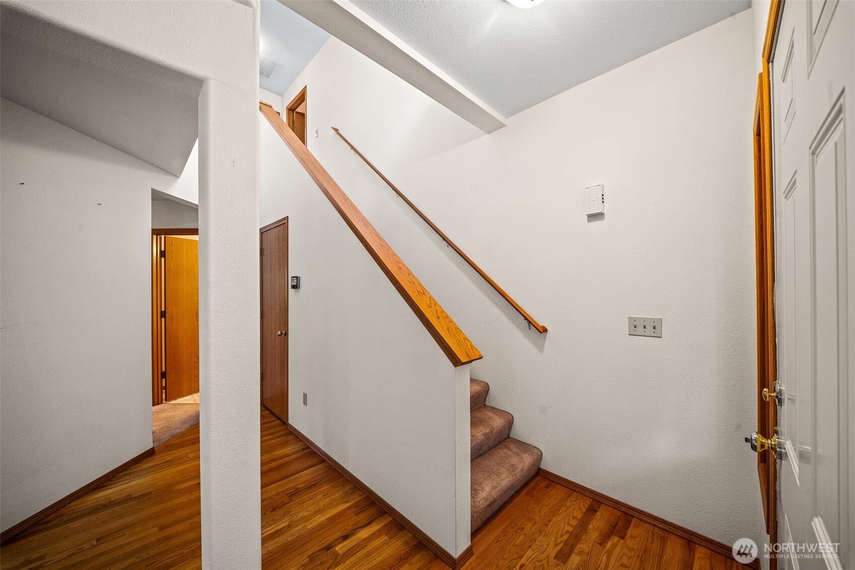 16011 Spanaway Loop Road South Spanaway, WA 98387 - Photo 14 of 35 a view of entryway with wooden floor and stairs
