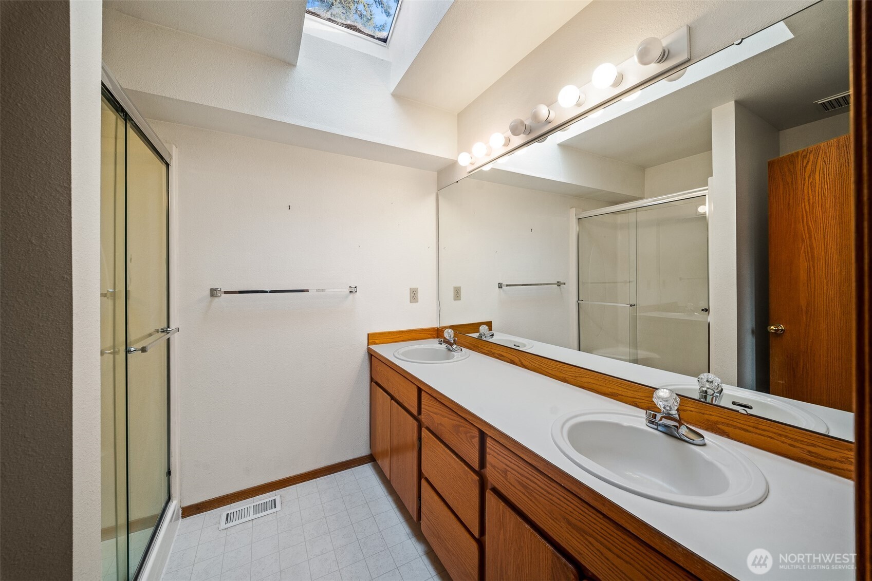 16011 Spanaway Loop Road South Spanaway, WA 98387 - Photo 20 of 35 a bathroom with a sink double vanity and a mirror