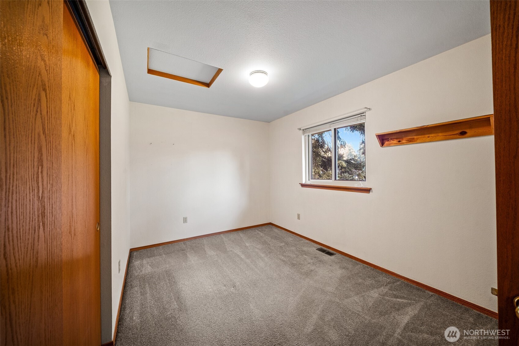 16011 Spanaway Loop Road South Spanaway, WA 98387 - Photo 22 of 35 an empty room with windows