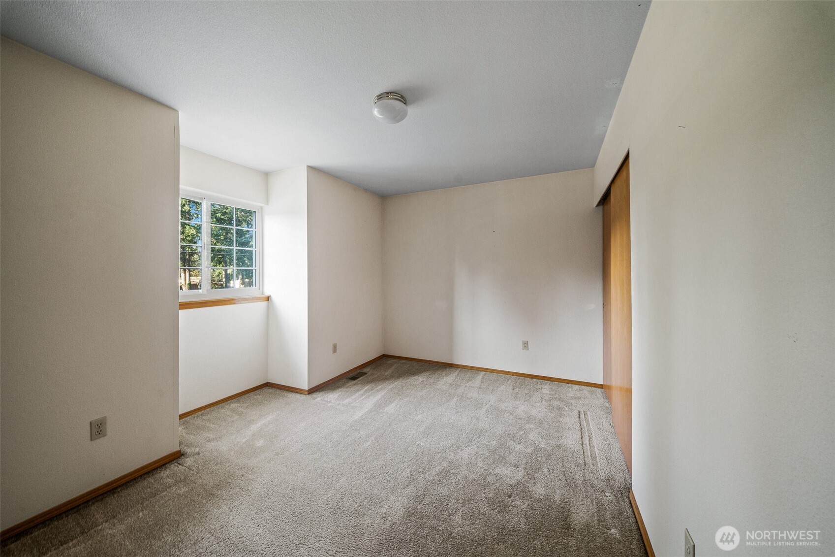 16011 Spanaway Loop Road South Spanaway, WA 98387 - Photo 23 of 35 an empty room with windows