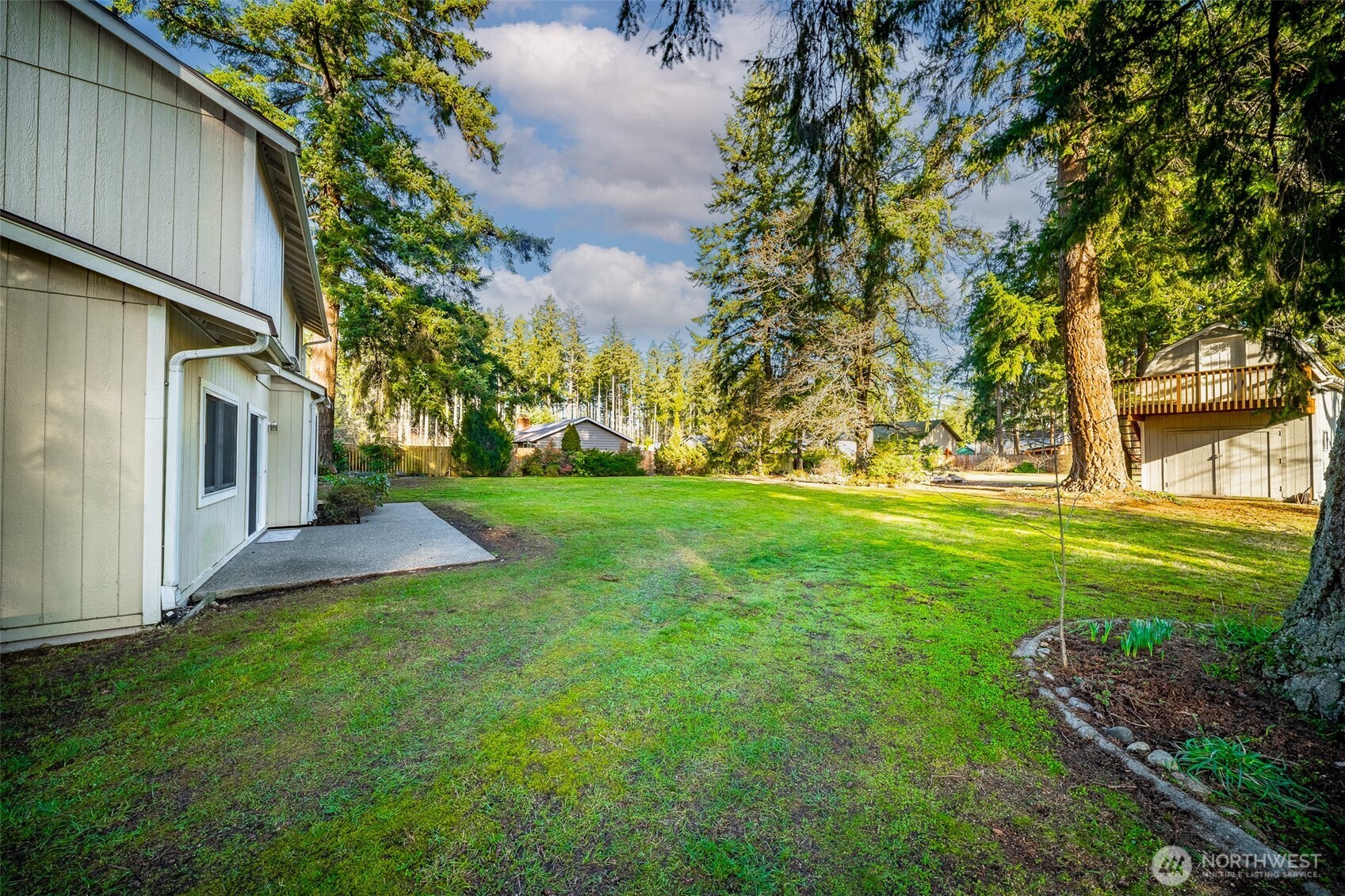 16011 Spanaway Loop Road South Spanaway, WA 98387 - Photo 28 of 35 a view of a backyard with large trees