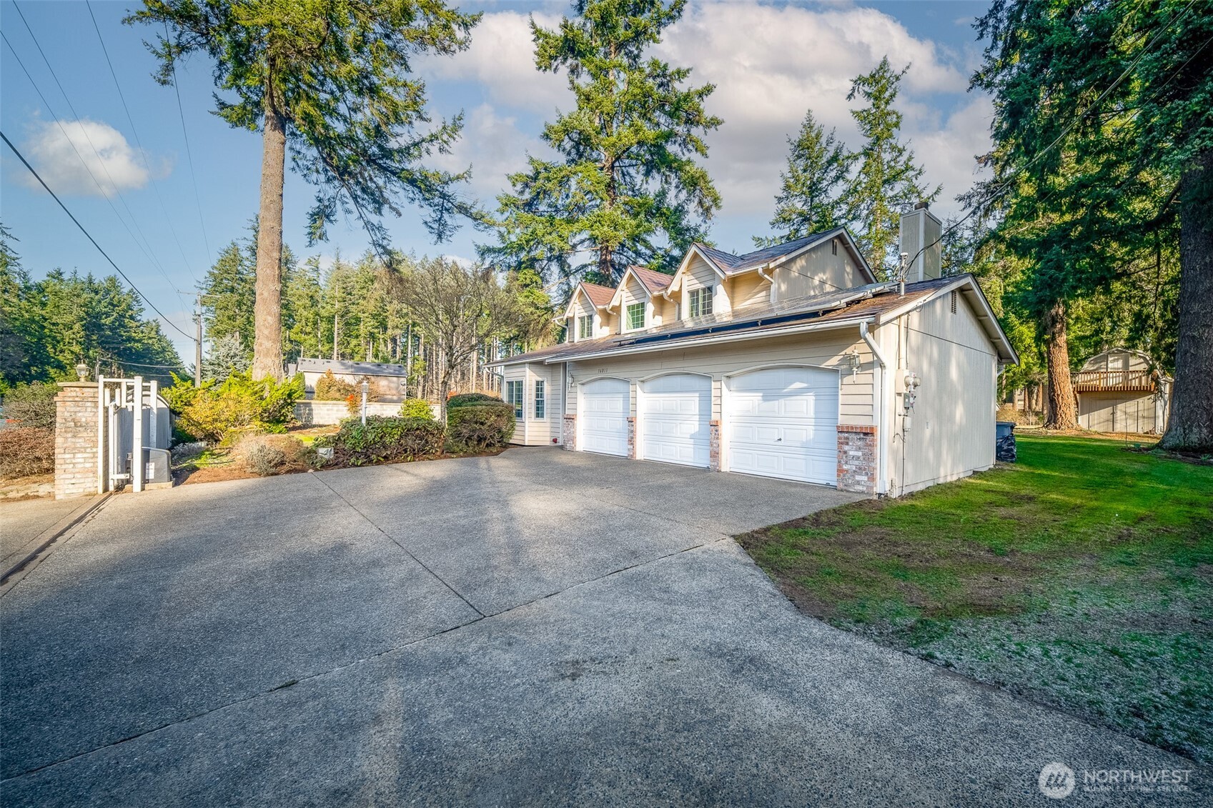 16011 Spanaway Loop Road South Spanaway, WA 98387 - Photo 3 of 35 a view of a house with a yard and garage