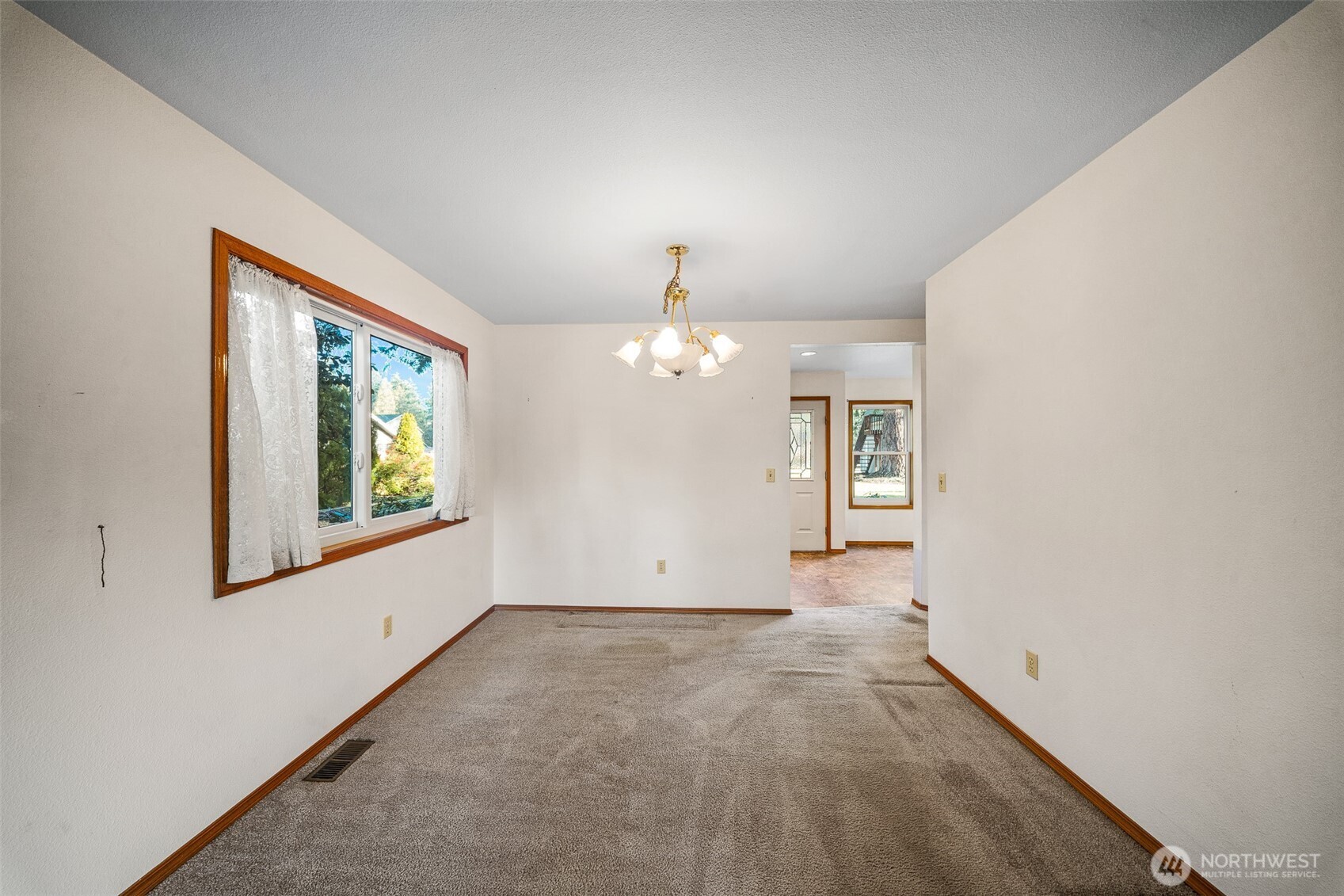 16011 Spanaway Loop Road South Spanaway, WA 98387 - Photo 8 of 35 a view of an empty room with a window